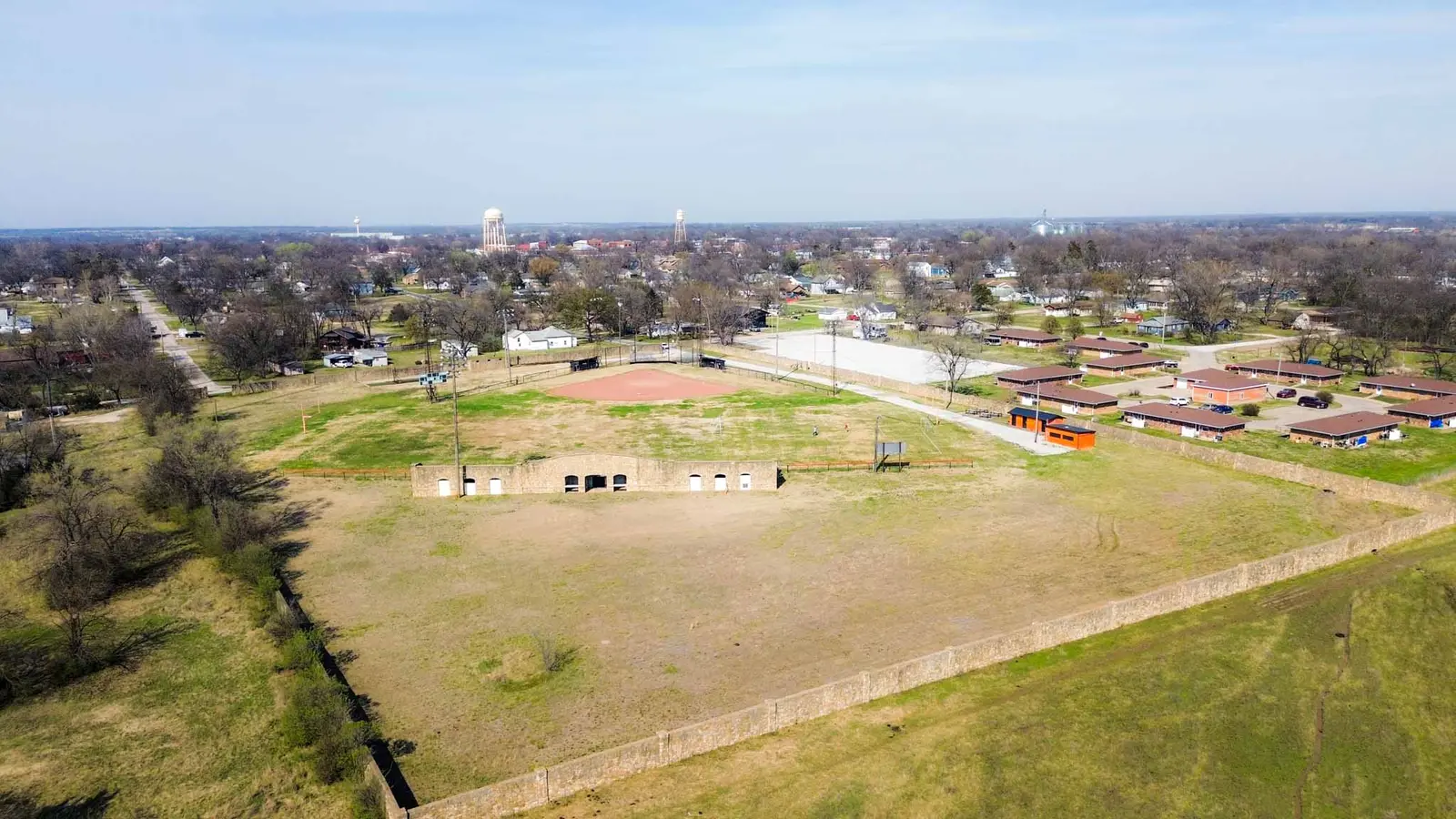 Aerial view of the Humboldt ballfields with the historic stone grandstand and the town skyline on the horizon.